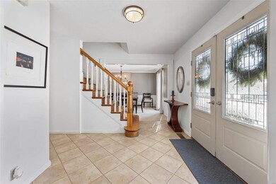 Enter to a formal entry through the double front doors. 