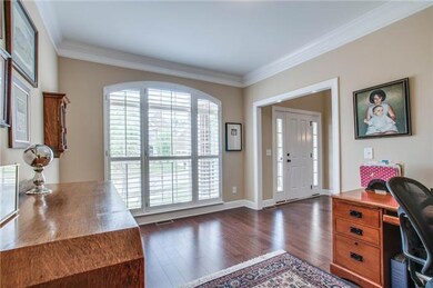 The original floor plan called this room a library, but we all know it can be a living room or as this family wanted, a family office. Notice the beautiful plantation shutters. 