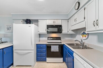 Kitchen with white appliances, light floors, blue 
