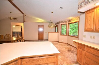 Looking from the Kitchen towards the Dining area. Notice the plywood floor?  All carpeting has been removed so it's a blank slate for your dream floor.