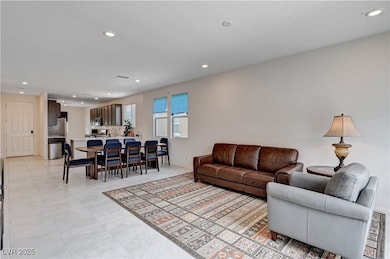 Living area with recessed lighting and light tile
