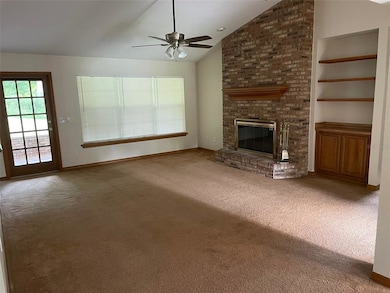 LIVING ROOM OPENS TO PATIO