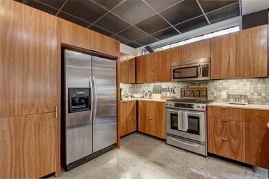Kitchen with stainless steel appliances, brown ca