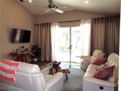 Living room with ceiling fan, hardwood / wood-styl