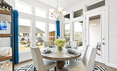 Dining area featuring a notable chandelier and har