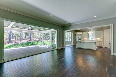 A retractable window wall opens up to let the outd