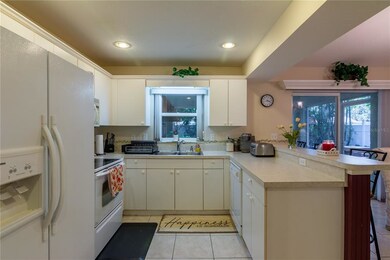 Pass thru window into kitchen makes entertaining a