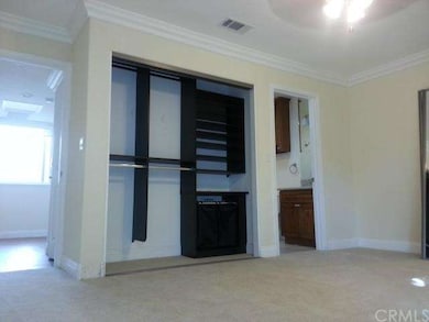 Master bedroom floor is carpeted, mirrored sliders