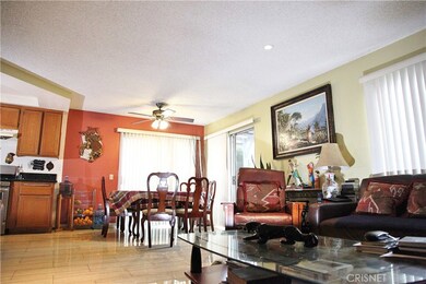 Open floor plan, dining area adjacent to living room and kitchen