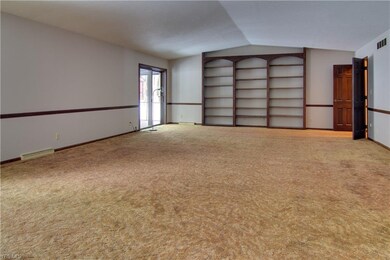 Built-in shelves at the other end.  The doors to t