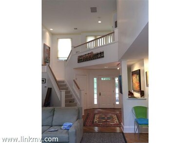 Soaring cathedral ceiling in living room open above