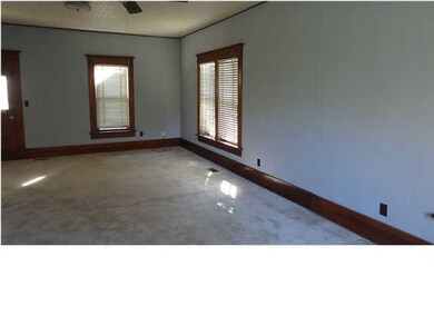 The large living room welcomes family and guests t