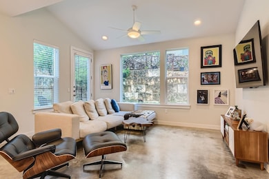 Living area featuring ceiling fan, baseboards, va