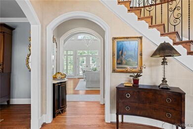 Foyer with light wood-type flooring, french doors,