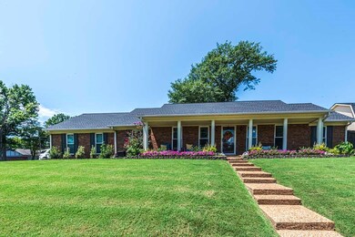 Ranch-style home with a front lawn
