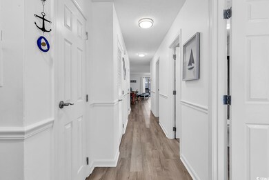 Corridor with wood finished floors