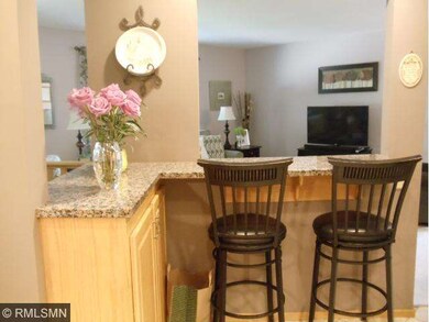 Granite counter with seating are in kitchen