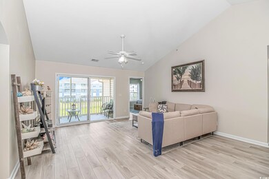 Living area with visible vents, baseboards, a ceil