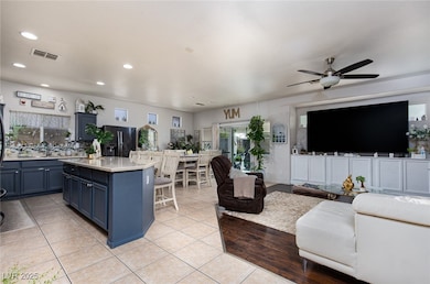 Living room featuring a ceiling fan, recessed ligh