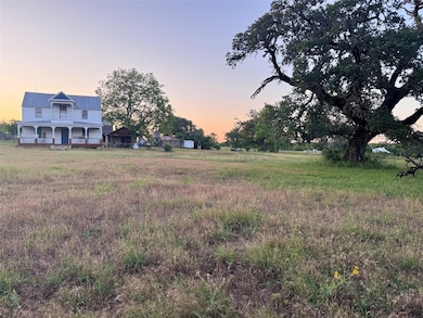View of yard featuring covered porch