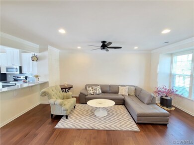 Family room featuring hardwood flooring, ornamenta