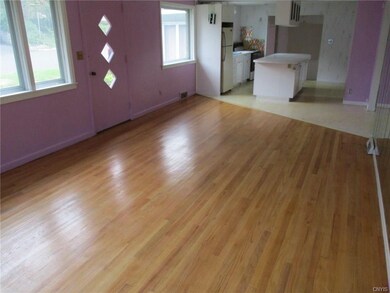 Apartment one has an open floor plan with kitchen 