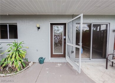 Doorway to property featuring a patio