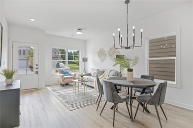 Dining room featuring light wood finished floors, 