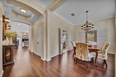 As you enter the home is a grand foyer with double crown molding and a recessed ceiling.