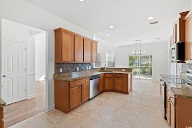 Kitchen featuring appliances with stainless steel 