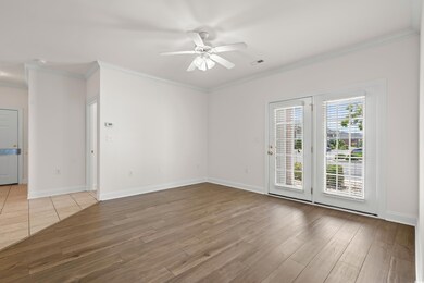 Empty room featuring ceiling fan, hardwood / wood-