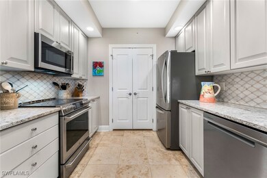 Kitchen with backsplash, stainless steel appliance