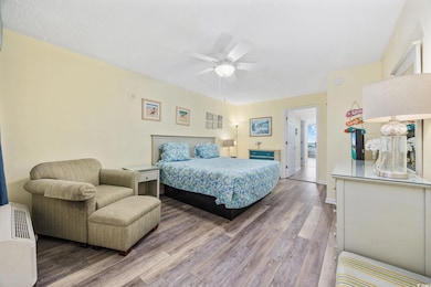 Bedroom with baseboards, light wood-style flooring