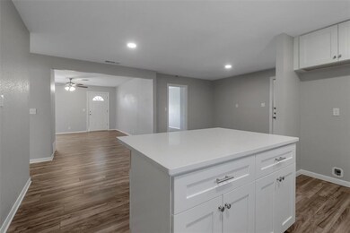 View from kitchen into the family room, and front 