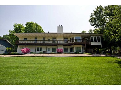 Exterior Back. Yard is landscaped beautifully and irrigation comes from the lake!