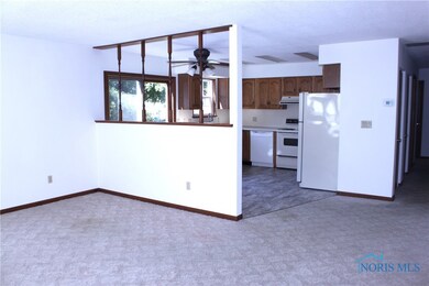 Living room is open to kitchen.