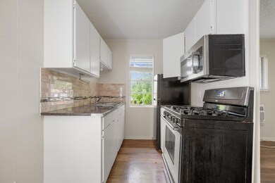 Kitchen with a sink, stainless steel appliances, 