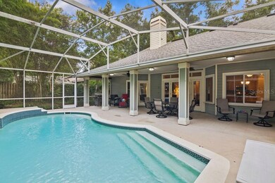 Spacious screen enclosed salt water pool and cover