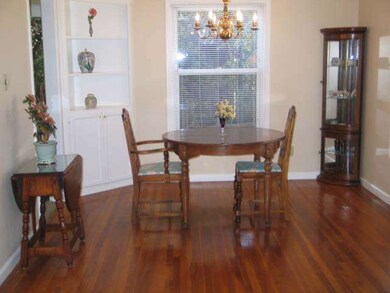 Built in corner cabiner, orig. hardwood floor.