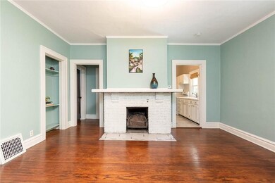 Hardwood floors throughout.  Bedroom to the back l
