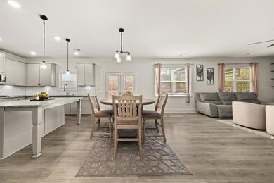 Dining space featuring light wood-style floors, recessed lighting, and baseboards