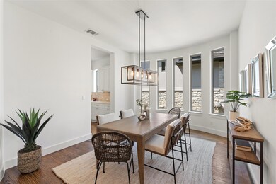 Dining space featuring wood finished floors and a