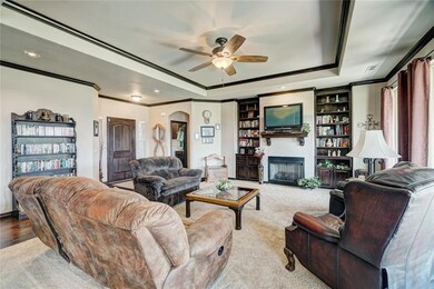 Living room with view of front door and laundry room.