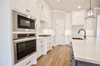 Kitchen featuring appliances with stainless steel 