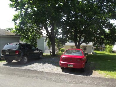 Rear alley parking for three cars.