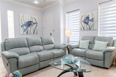 Tiled living room featuring ornamental molding