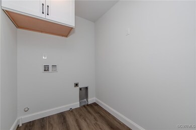 Laundry room featuring cabinet space, hookup for a