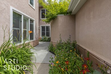 Doorway to property featuring stucco siding