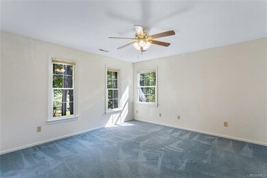 Master Bedroom with carpet, ceiling fan with light