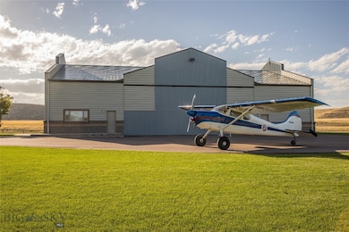 Private airplane hangar with workshop, ADU apartment, and garage